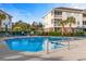 A refreshing community pool with lounge chairs and umbrellas for residents to relax and enjoy the sunny days at 5751 Oyster Catcher Dr. # 633, North Myrtle Beach, SC 29582