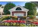 A welcoming community entrance sign at the Wedgewood neighborhood, with colorful flowers and a beautiful design at 5751 Oyster Catcher Dr. # 633, North Myrtle Beach, SC 29582