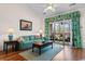 Comfortable living room showcasing a slider door, wood floors, and bright décor at 5751 Oyster Catcher Dr. # 633, North Myrtle Beach, SC 29582