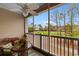 Relaxing screened porch with seating, ceiling fan, and views of the green golf course at 5751 Oyster Catcher Dr. # 633, North Myrtle Beach, SC 29582