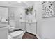 Contemporary powder room featuring dual flush toilet, mirrored wall, and bright white vanity at 602 Sea Vista Ln., North Myrtle Beach, SC 29582