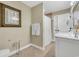 Bathroom with a large framed art print, large vanity and tile floors at 602 Sea Vista Ln., North Myrtle Beach, SC 29582