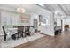 Dining room features a chandelier, windows, and views of the modern kitchen at 602 Sea Vista Ln., North Myrtle Beach, SC 29582