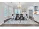 Bright dining room with big windows and a chandelier at 602 Sea Vista Ln., North Myrtle Beach, SC 29582