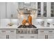 Close-up of gourmet kitchen area featuring stainless steel appliances and white countertops at 602 Sea Vista Ln., North Myrtle Beach, SC 29582