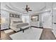 Bright main bedroom with a ceiling fan, a bed, and a view of the outside at 602 Sea Vista Ln., North Myrtle Beach, SC 29582