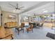 Spacious covered patio featuring a ceiling fan, outdoor seating, and a view of landscaped backyard at 602 Sea Vista Ln., North Myrtle Beach, SC 29582