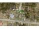 Aerial view of the property, showing the house, an apartment, and surrounding neighborhood with street access at 606 Dawson St., Georgetown, SC 29440