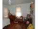 This bedroom features hardwood floors, light walls, and a bright window at 606 Dawson St., Georgetown, SC 29440