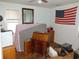 Bedroom with light blue walls, hardwood floor, a ceiling fan, and an American flag at 606 Dawson St., Georgetown, SC 29440