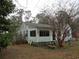 Charming cottage-style home featuring light green siding and a cozy screened-in porch at 606 Dawson St., Georgetown, SC 29440