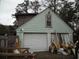 Spacious garage with two doors, offering ample storage and workspace with additional storage space above at 606 Dawson St., Georgetown, SC 29440