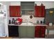 Kitchen featuring two-toned cabinetry, tiled backsplash, and standard appliances at 606 Dawson St., Georgetown, SC 29440