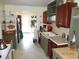 Functional kitchen featuring tile floors, tile countertop, and a view to the dining room at 606 Dawson St., Georgetown, SC 29440