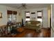 Cozy living room featuring hardwood floors, neutral walls, and a comfortable green sofa at 606 Dawson St., Georgetown, SC 29440