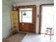 Inside the sun room with plywood walls, a light shelf and a door at 606 Dawson St., Georgetown, SC 29440