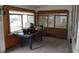 Enclosed sunroom with tile flooring and multiple windows offering natural light at 606 Dawson St., Georgetown, SC 29440