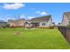 Expansive backyard featuring lush green grass, a gazebo, and a fenced perimeter for added privacy at 641 Indigo Bay Circle, Myrtle Beach, SC 29579