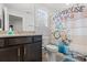 Bathroom features granite countertop, dark wood cabinets, a toilet, and a farmhouse-themed shower curtain at 641 Indigo Bay Circle, Myrtle Beach, SC 29579