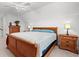 Bedroom with plush carpet, ceiling fan, natural light and wooden furniture at 641 Indigo Bay Circle, Myrtle Beach, SC 29579