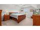 Bedroom with plush carpet, ceiling fan, natural light and wooden furniture at 641 Indigo Bay Circle, Myrtle Beach, SC 29579