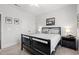 Serene bedroom with a black bed frame, soft carpet, and minimal decor for a relaxing atmosphere at 641 Indigo Bay Circle, Myrtle Beach, SC 29579