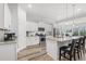 Modern kitchen featuring white cabinets, stainless steel appliances, granite countertops, and an island with bar seating at 641 Indigo Bay Circle, Myrtle Beach, SC 29579