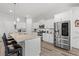 Bright kitchen featuring white cabinets, stainless steel appliances, and a large center island with granite countertop at 641 Indigo Bay Circle, Myrtle Beach, SC 29579