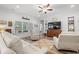 Inviting living room featuring hardwood floors, plush furniture, and a large window for abundant natural light at 641 Indigo Bay Circle, Myrtle Beach, SC 29579