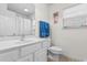 Bright bathroom featuring white vanity, toilet, shower-tub, and complementary decor at 6494 Royal Pine Dr., Myrtle Beach, SC 29588