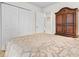 Comfortable bedroom featuring neutral tones, closet, and attractive wood armoire at 6494 Royal Pine Dr., Myrtle Beach, SC 29588