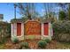 Entrance to 'The Gardens' community with brick sign and manicured landscaping at 6494 Royal Pine Dr., Myrtle Beach, SC 29588