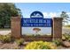 Elegant brick sign marking the entrance to Myrtle Beach Golf & Yacht Club at 6494 Royal Pine Dr., Myrtle Beach, SC 29588