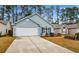 Inviting home featuring attached two-car garage, blue siding and neatly trimmed landscaping at 6494 Royal Pine Dr., Myrtle Beach, SC 29588