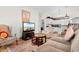 Bright living room featuring hardwood floors, comfortable seating, and a view to the kitchen and breakfast bar at 6494 Royal Pine Dr., Myrtle Beach, SC 29588