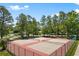 Well-maintained tennis courts offer recreational opportunities in a serene, tree-lined environment at 6494 Royal Pine Dr., Myrtle Beach, SC 29588