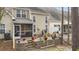 View of the back of the house and screened in porch from the stone patio and surrounding treeline at 651 Riverward Dr. # 651, Myrtle Beach, SC 29588