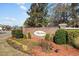 Entrance to the Riverbend community with brick sign and landscaped surroundings at 651 Riverward Dr. # 651, Myrtle Beach, SC 29588