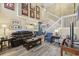 Inviting living room featuring a brown leather couch and decor, with a staircase leading to the second floor at 651 Riverward Dr. # 651, Myrtle Beach, SC 29588