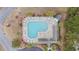 Aerial view of a community pool featuring lounge chairs and tables with umbrellas at 651 Riverward Dr. # 651, Myrtle Beach, SC 29588