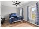 Bedroom with hardwood floors, vaulted ceiling, ceiling fan, and large windows at 8035 Arcady St. # B, Myrtle Beach, SC 29572