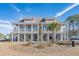 Stunning two-story townhome with double balconies, brick accents, and a well-manicured front yard at 8035 Arcady St. # B, Myrtle Beach, SC 29572