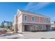 Street view of a three-story townhouse with drive-under garage and brick accents at 8035 Arcady St. # B, Myrtle Beach, SC 29572