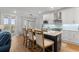 Kitchen island with a marble countertop, seating for four, and stainless steel appliances at 8035 Arcady St. # B, Myrtle Beach, SC 29572