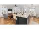 Stylish kitchen island with granite countertops, seating, and a view into the living area at 8035 Arcady St. # B, Myrtle Beach, SC 29572