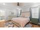 A beautifully appointed bedroom featuring a serene color palette and ample natural light at 8035 Arcady St. # B, Myrtle Beach, SC 29572