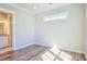 Light-filled bedroom with hardwood floors adjacent to a bathroom with modern finishes at 8079 Laurel Ash Ave., Myrtle Beach, SC 29572