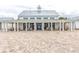 Expansive clubhouse exterior featuring covered seating areas, perfect for relaxing and socializing with neighbors and friends at 8079 Laurel Ash Ave., Myrtle Beach, SC 29572