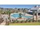 Inviting community pool with palm trees and lounge chairs creates a relaxing oasis for residents and guests to enjoy at 8079 Laurel Ash Ave., Myrtle Beach, SC 29572