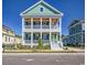 Charming two-story home with a double porch featuring a stylish green exterior at 8079 Laurel Ash Ave., Myrtle Beach, SC 29572